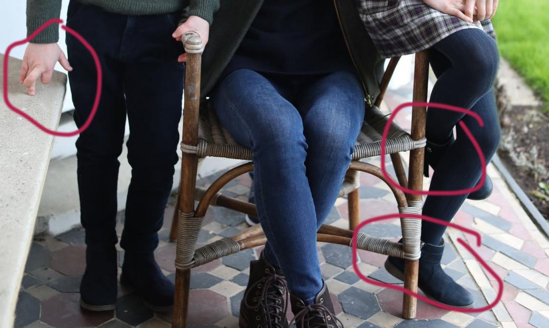 Louis’ hand and Charlotte’s boots circled